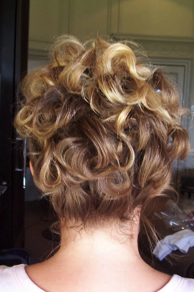 Voluminous curly updo, pinned at the back