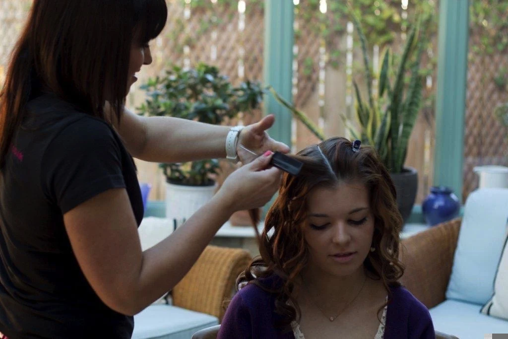 Styling long hair during a home visit